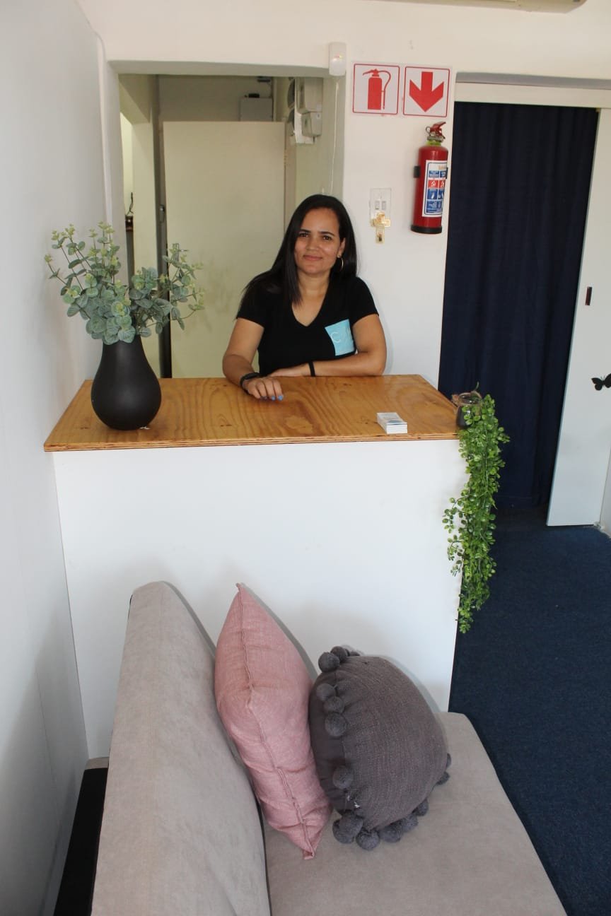 Caren Marnies at the CarenM reception desk